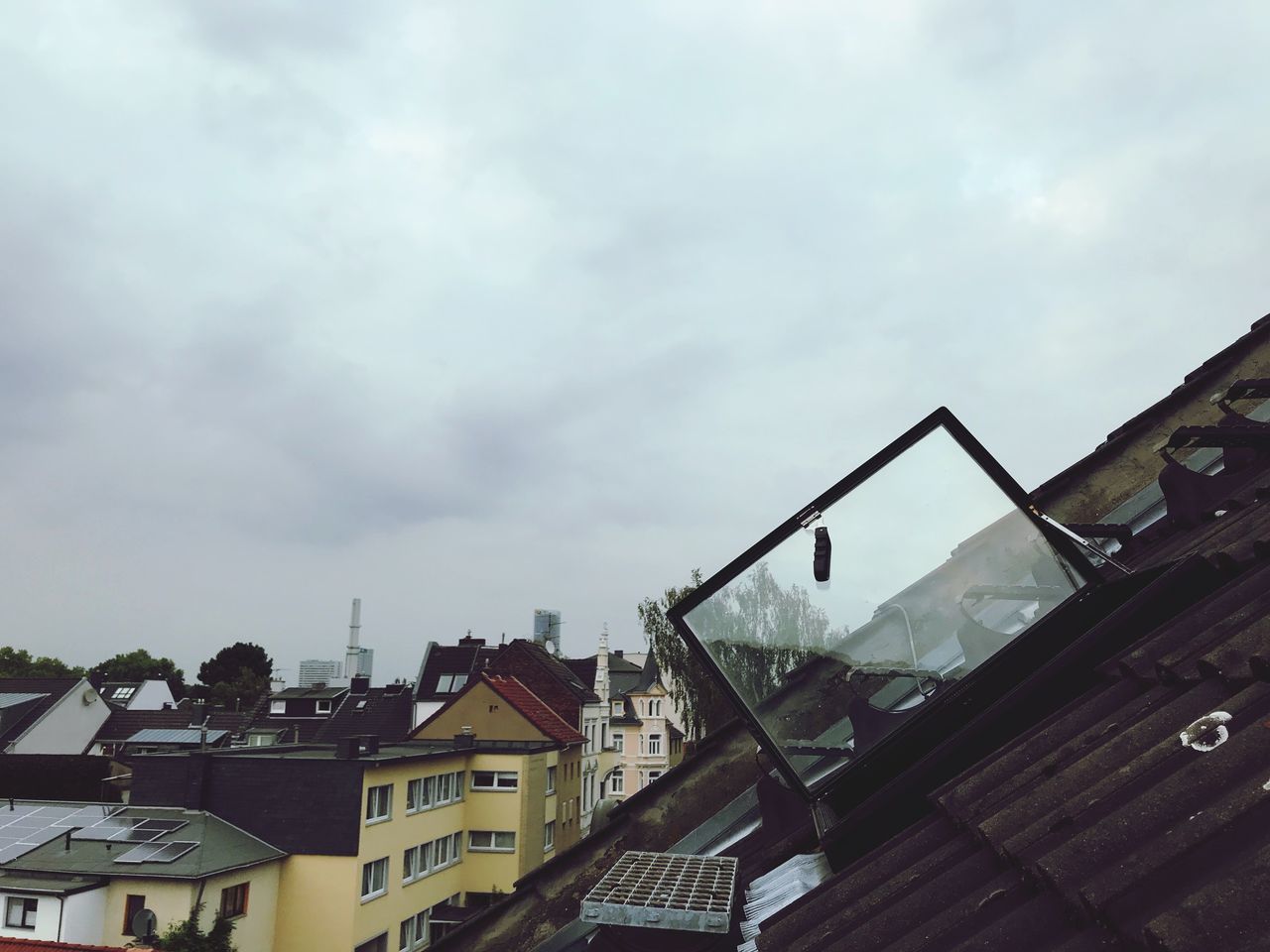 BUILDINGS SEEN THROUGH WET WINDOW