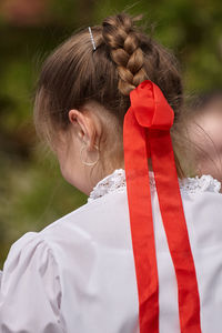 Rear view of woman with red umbrella