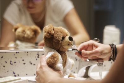 Close-up of hand holding stuffed toy