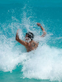 People surfing in sea