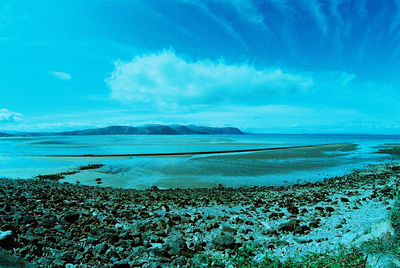 Scenic view of sea against blue sky