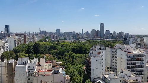 Buildings in city against sky