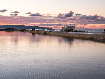 Scenic view of lake against sky during sunset