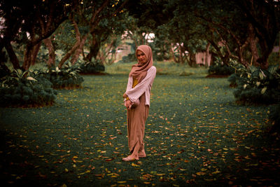 Full length of a woman standing in park