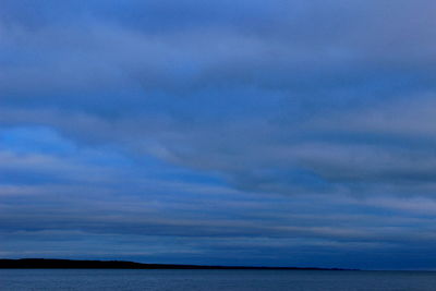 Scenic view of sea against sky at sunset