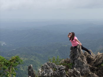 Woman looking at view on mountain