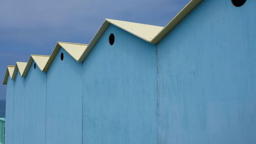 Low angle view of building against blue sky