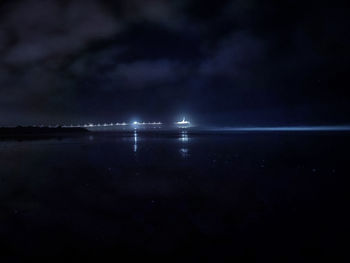 Scenic view of sea against sky at night