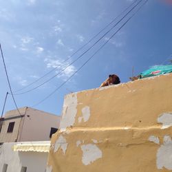 Low angle view of built structure against blue sky