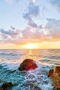 Scenic view of sea against sky during sunset