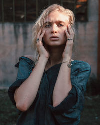 Portrait of woman standing outdoors