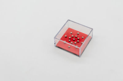 High angle view of red box against white background