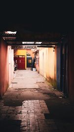 Empty alley amidst buildings