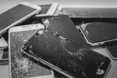 Close-up of broken mobile phones