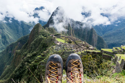 Low section of man against machu picchu