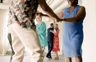 Senior couple enjoying while dancing in class