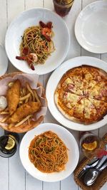 Pizza, fish and chips, pasta, fries by the beach