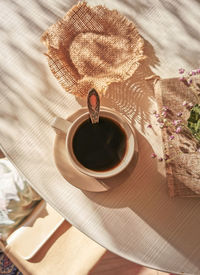 High angle view of coffee cup on table