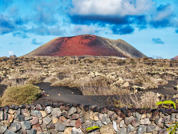 Scenic view of rocks on land against sky