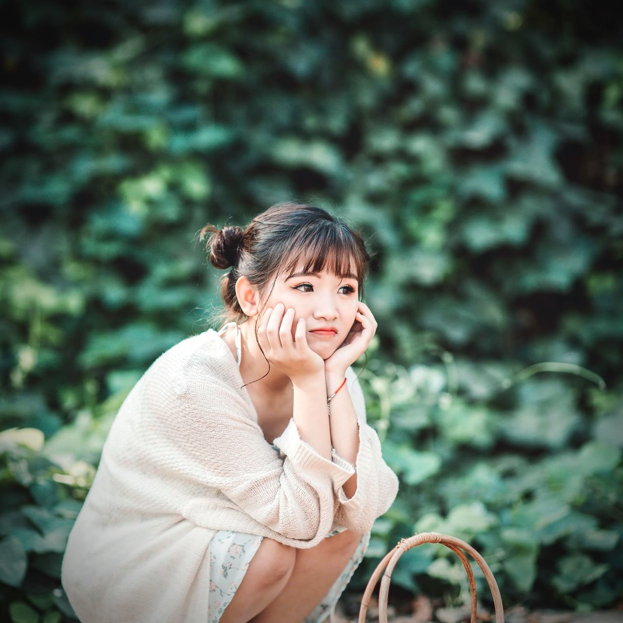 one person, portrait, focus on foreground, looking at camera, leisure activity, real people, lifestyles, smiling, front view, waist up, women, day, childhood, happiness, child, casual clothing, nature, emotion, plant, innocence, outdoors, hairstyle