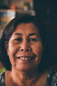 Close-up portrait of smiling senior woman