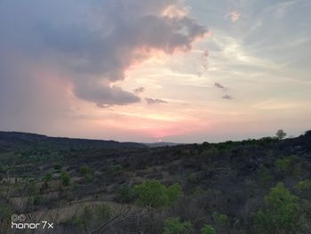 Scenic view of landscape against sky during sunset