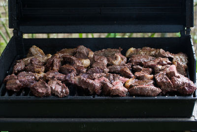 Close-up of meat on barbecue grill