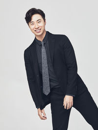 Portrait of young man against white background