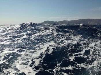 Aerial view of sea against clear sky