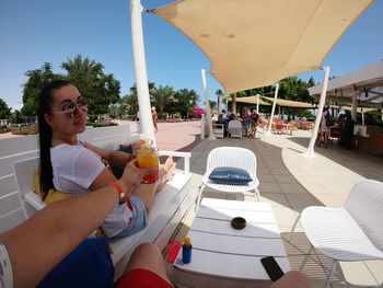 Woman sitting on chair at table