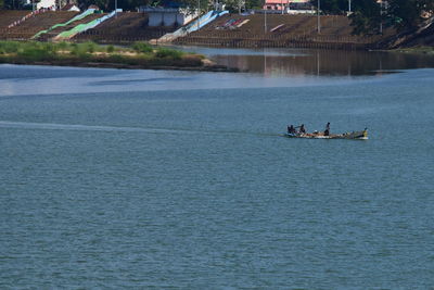 People on boat in river