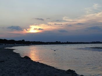 Scenic view of sea at sunset