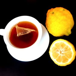 High angle view of orange slices against black background