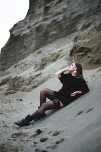 Woman sitting on beach