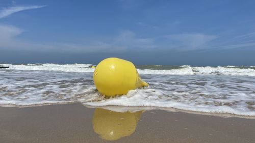 Yellow ball on beach
