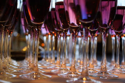 Close-up of wine glasses on table
