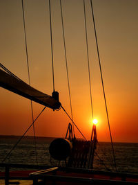 Boat sailing in sea during sunset