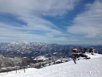 Scenic view of snowcapped mountains against sky