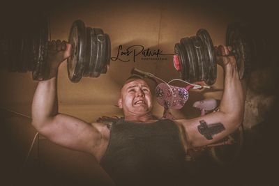 Portrait of shirtless man with text