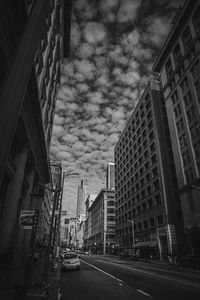 City street amidst buildings against sky