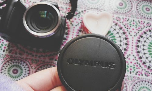Close-up of hand holding eyeglasses