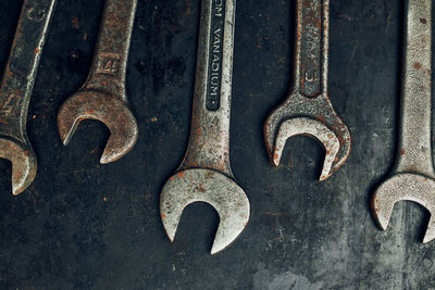 Spanners on steel surface. old rusty wrenches for maintenance. mechanic hardware tools to fix. tech