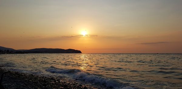 Scenic view of sea against sky during sunset