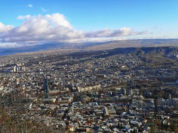 Aerial view of city against sky