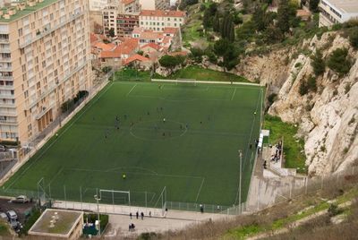 High angle view of soccer field by building