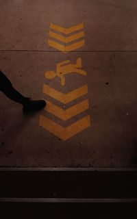 Low section of person standing on street