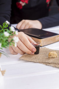 Midsection of woman working on table