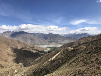 Scenic view of landscape and mountains against sky