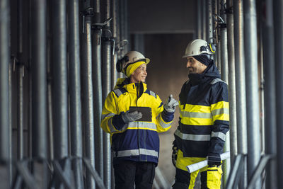 Engineers talking at building site