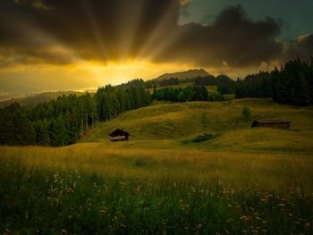 Scenic view of landscape against sky during sunset